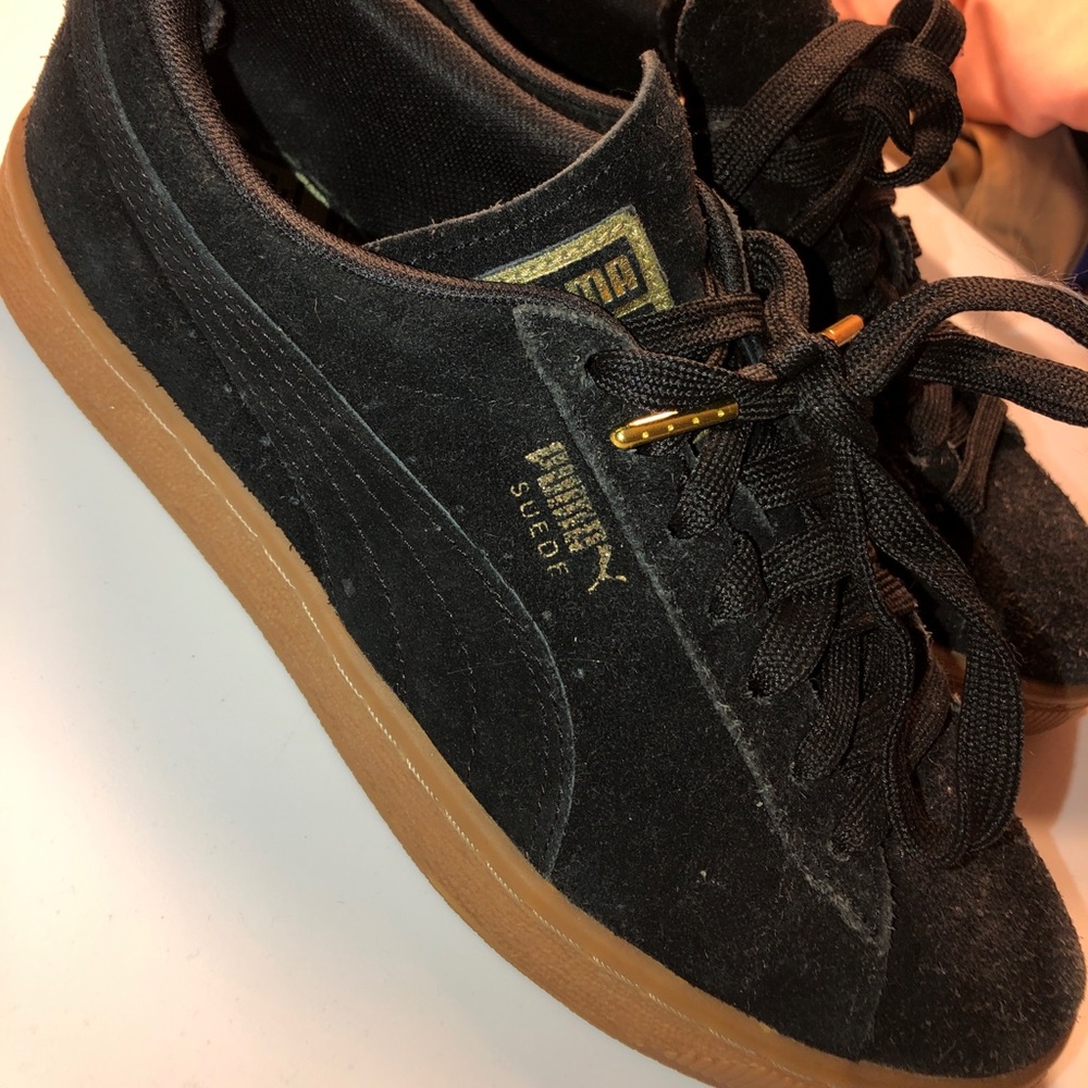 Women’s black Puma suede athletic sneakers